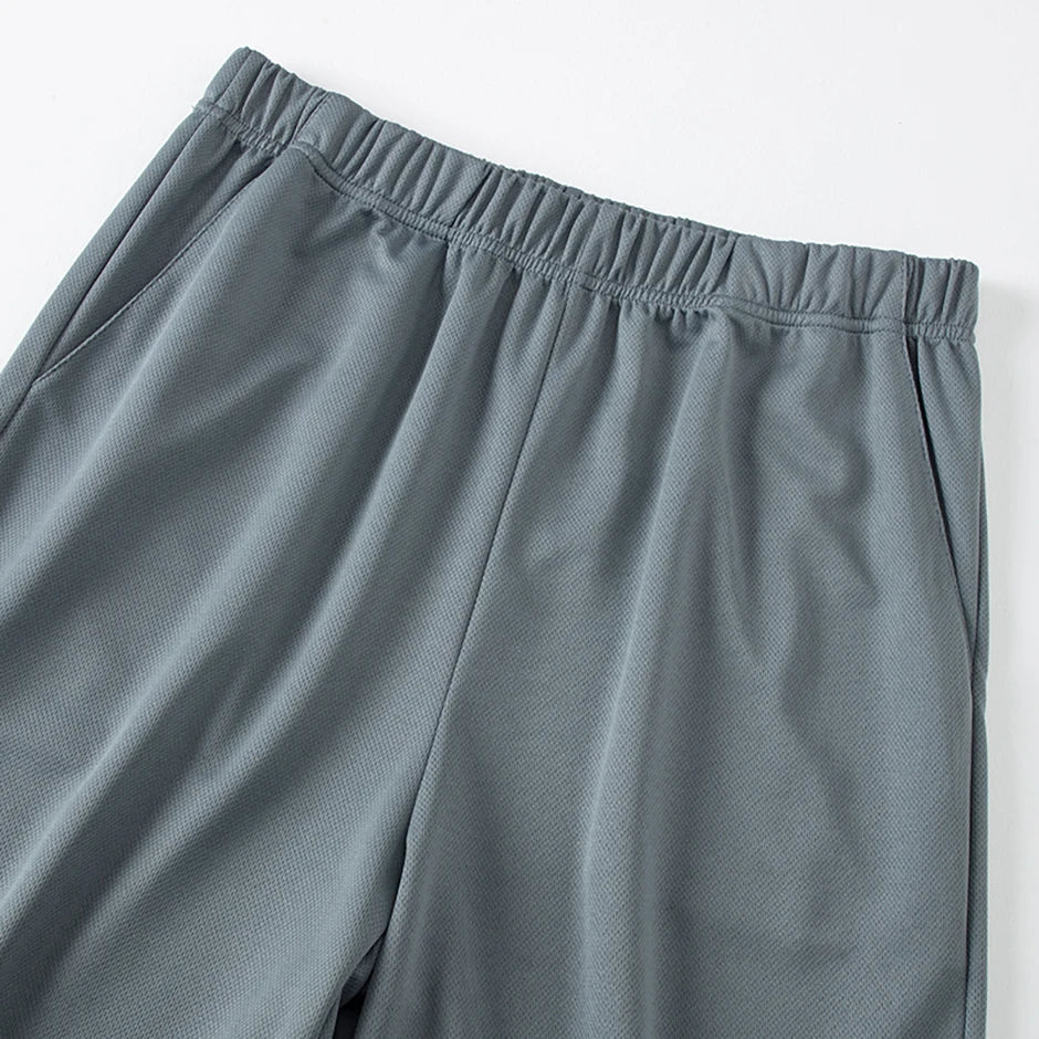 Tuta sportiva estiva da uomo in 2 pezzi ad asciugatura rapida T-shirt a maniche corte ampia e traspirante da corsa e fitness Pantaloncini tascabili neri