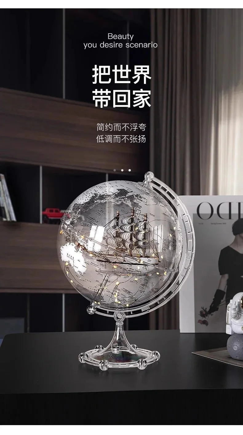 Ornamento moderno di lusso a globo con accenti di barca a vela, elegante scultura in metallo per soggiorno, supporto TV, armadietto del vino, scrivania da ufficio